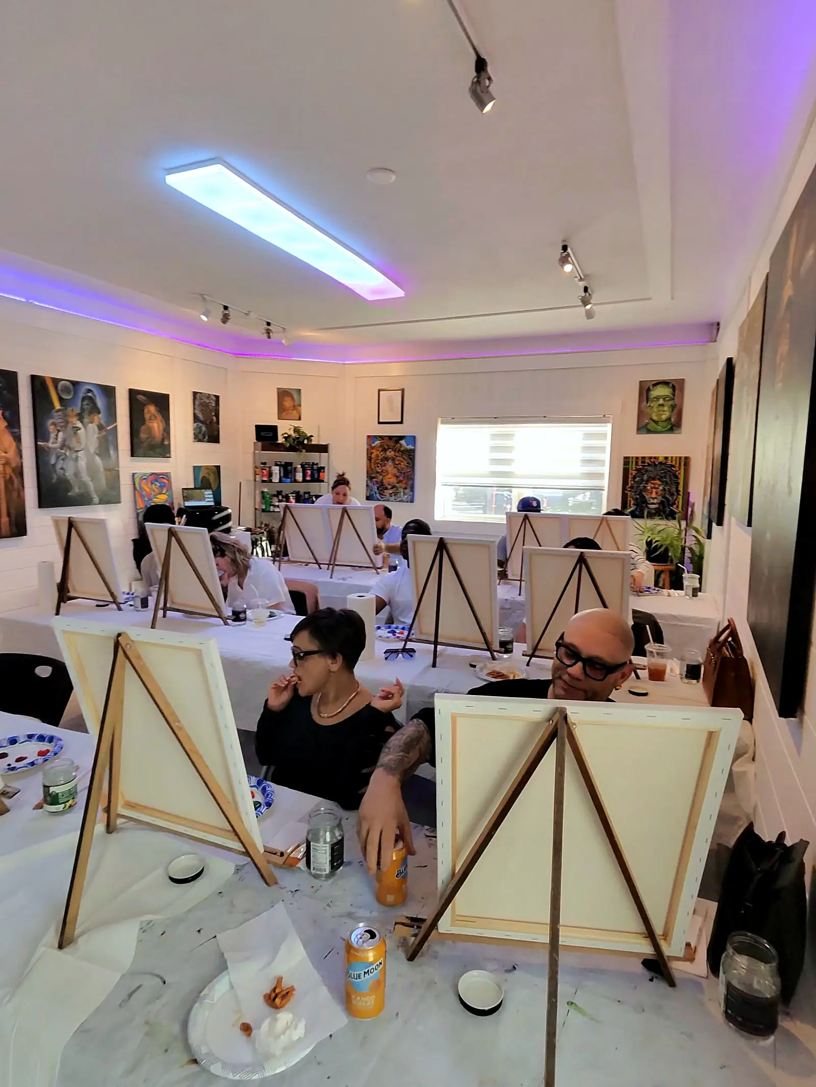 Easels set up for a paint party in the studio