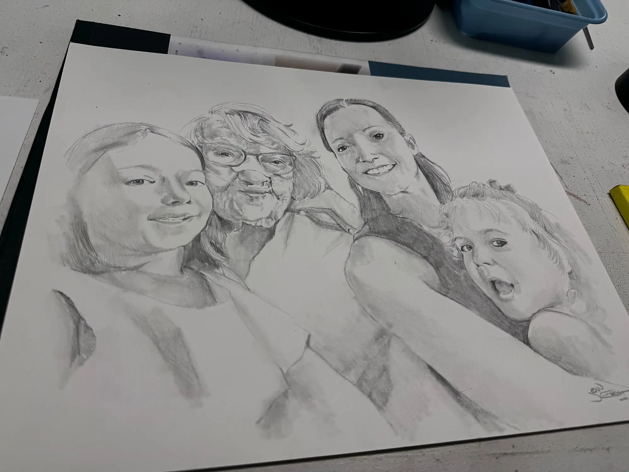 Pencil portrait of four generations of a family