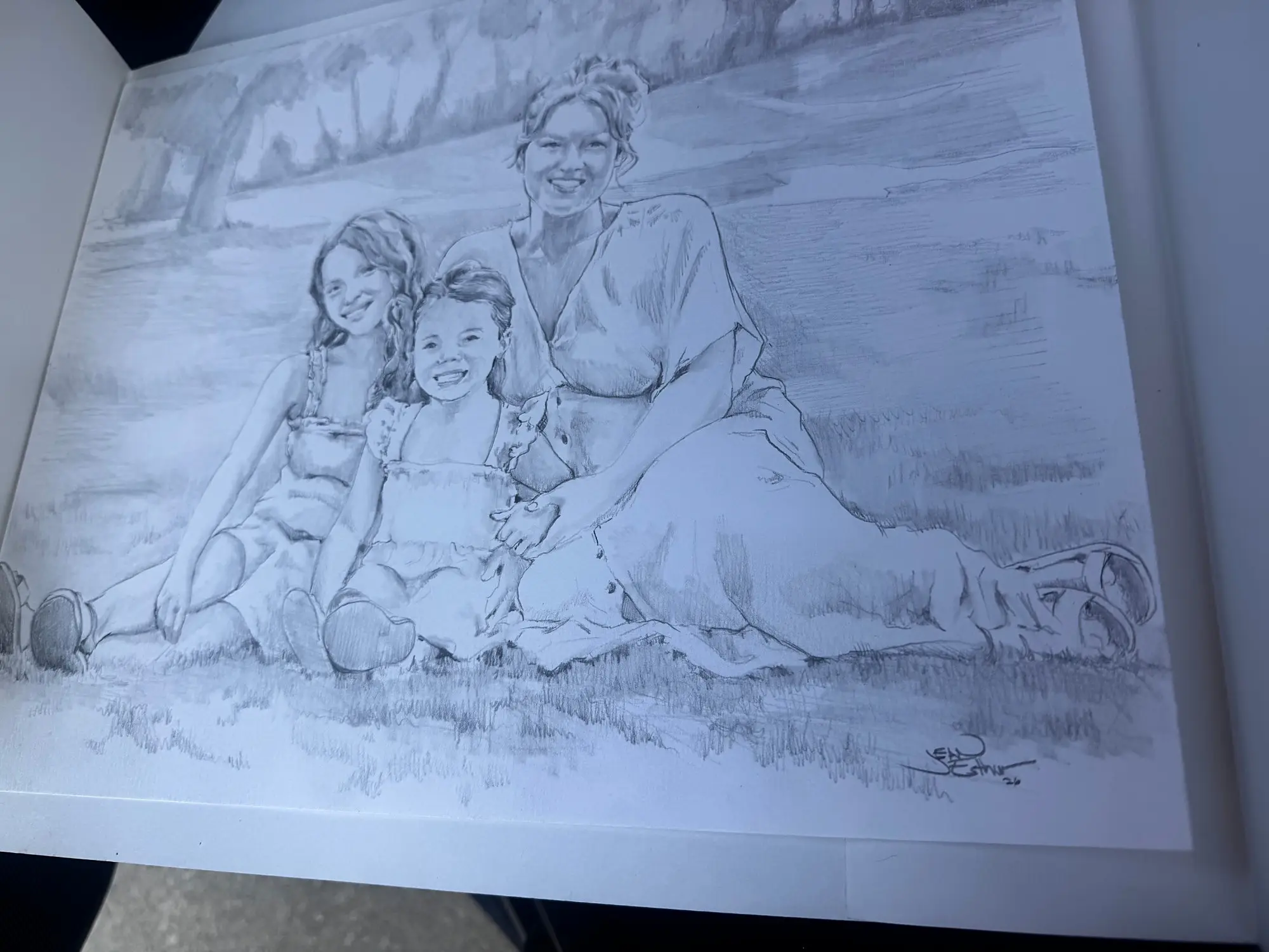 Pencil drawing of a mother and two daughters sitting in the grass