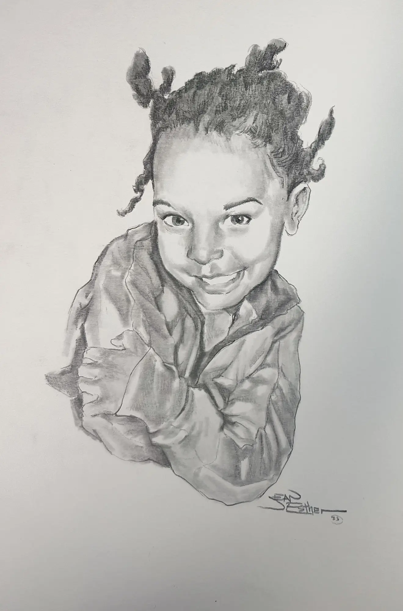 Pencil portrait of a smiling child with pigtails