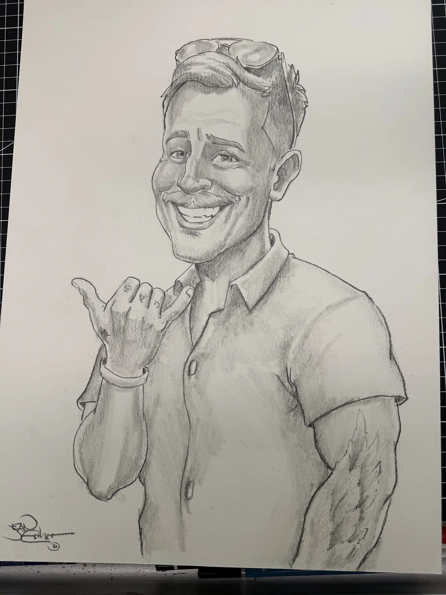 Pencil caricature of a grinning man throwing a shaka sign