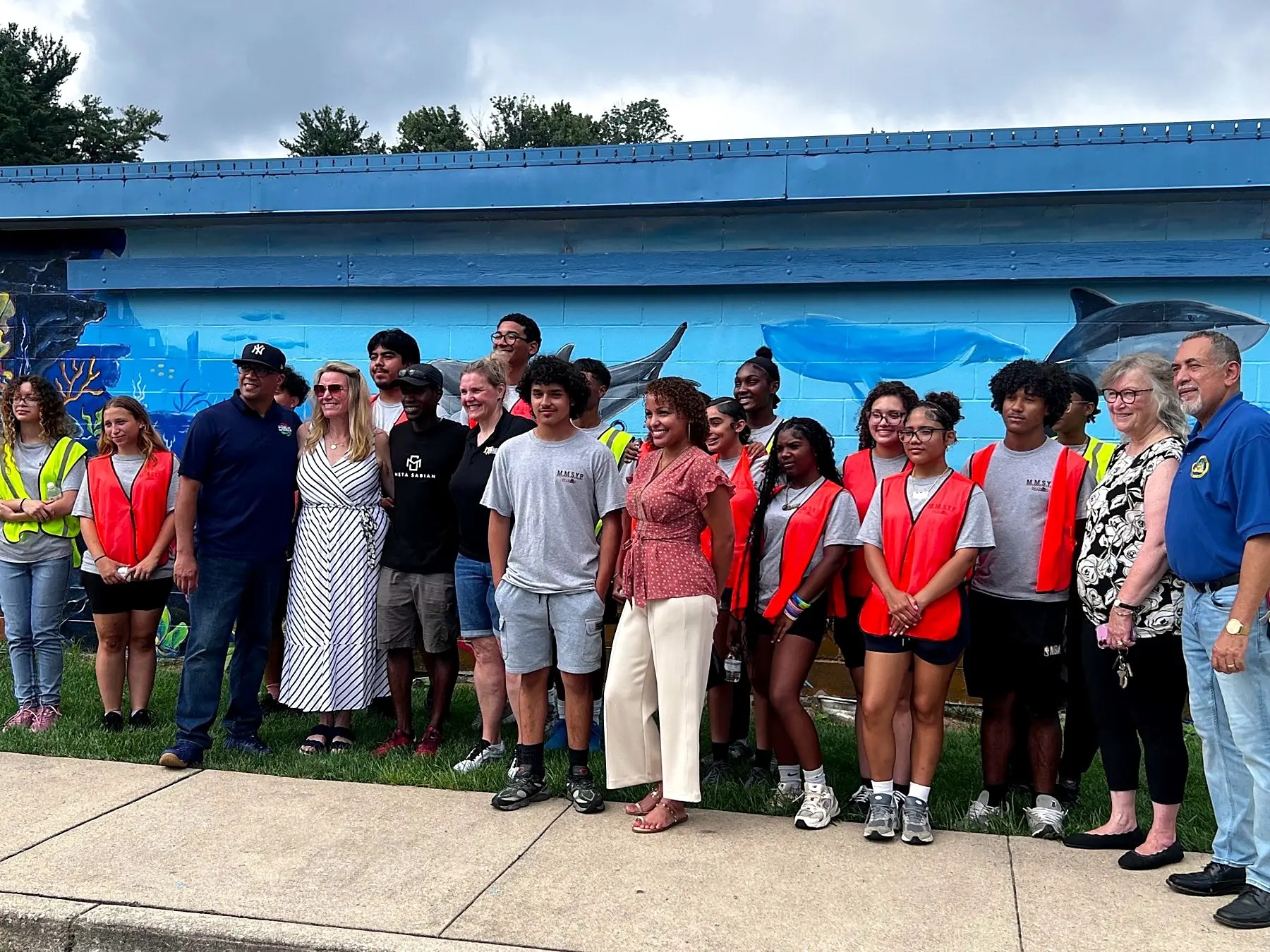 Students and neighbours at a mural unveiling