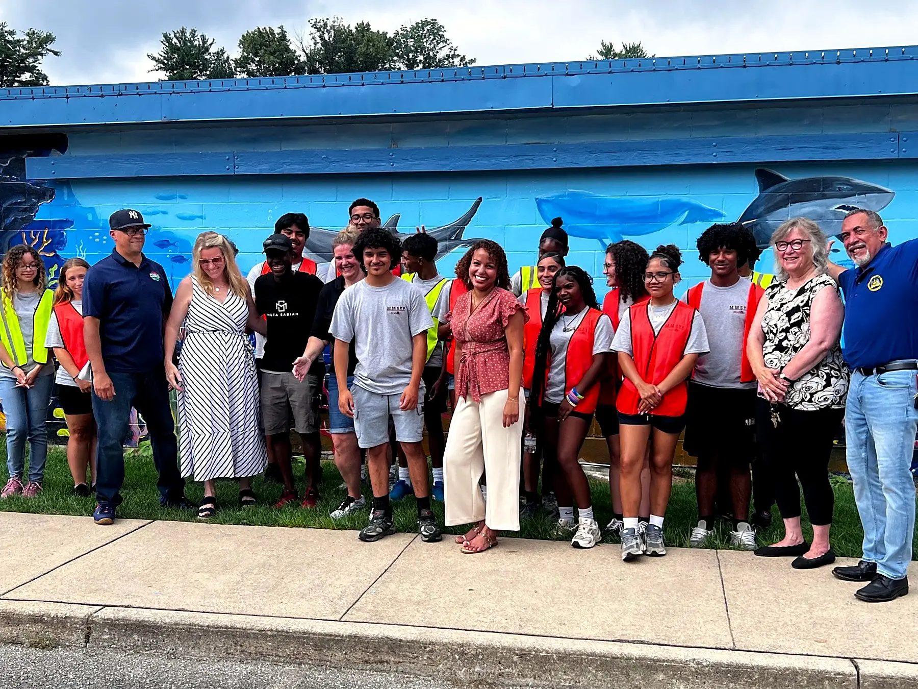 The mural crew in front of the finished ocean mural