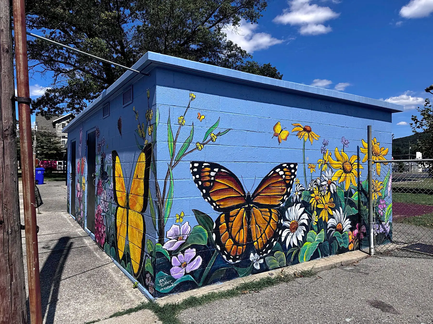 Butterfly garden mural on a community building
