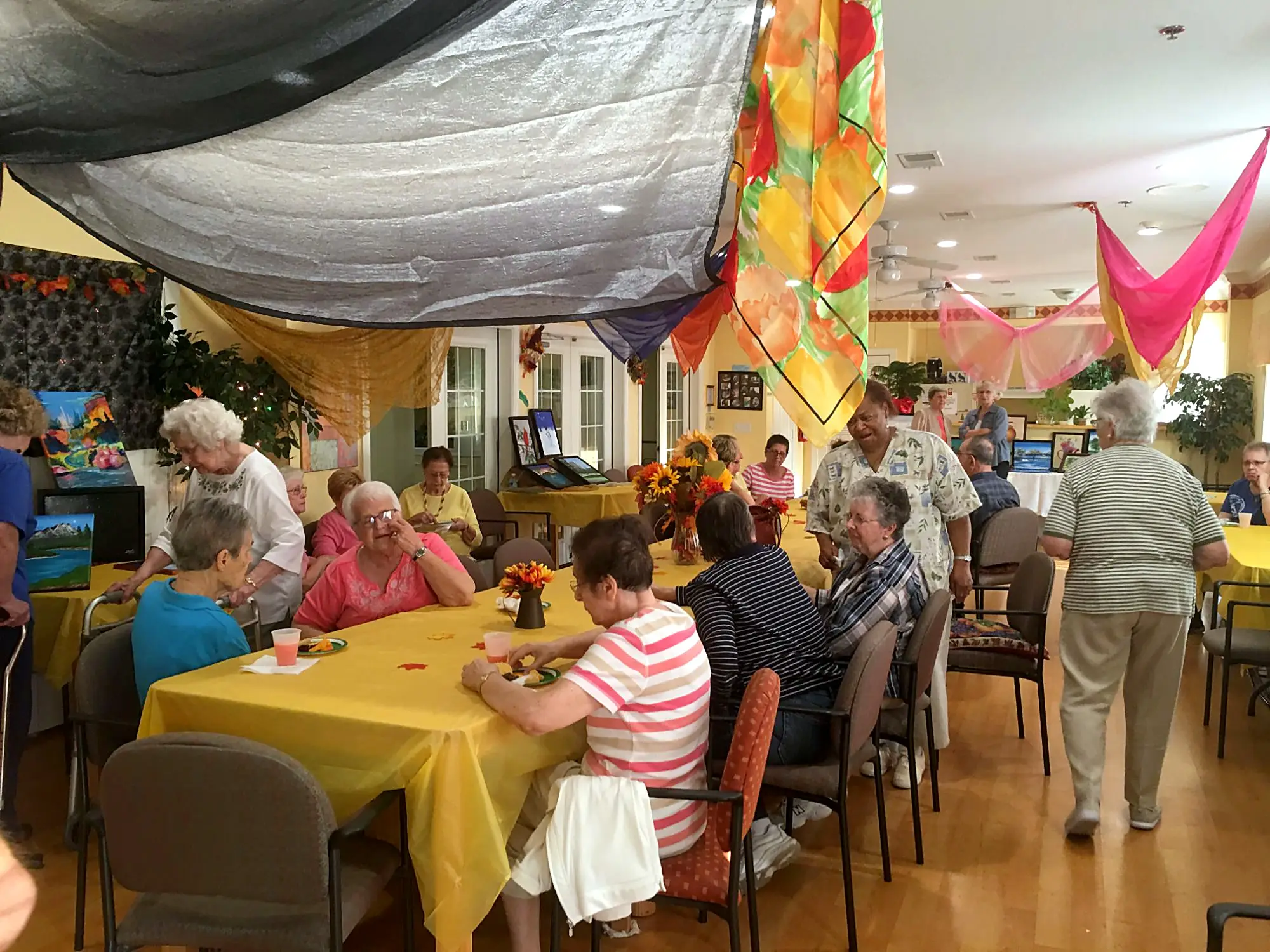 Seniors and guests celebrating at the art show reception